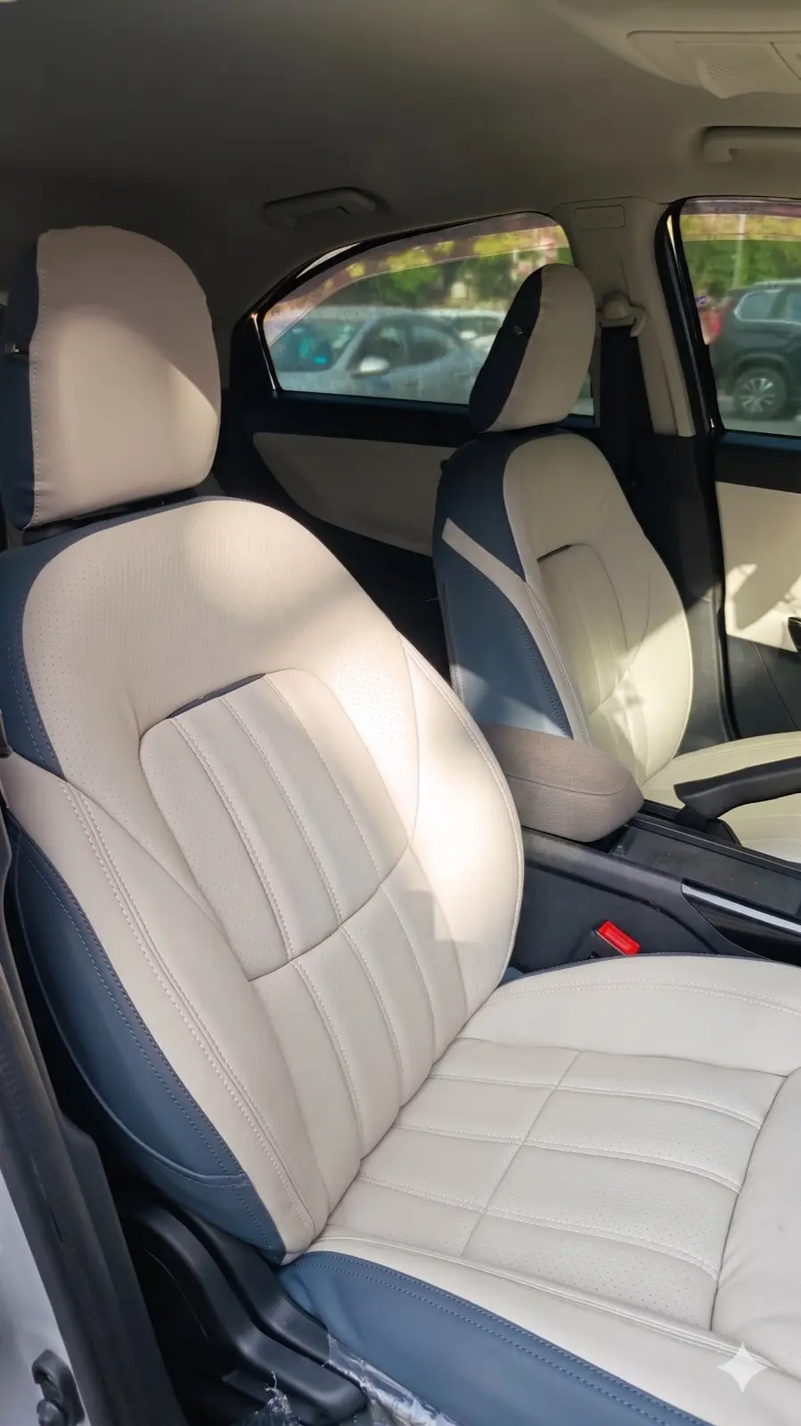Cream and blue custom-fit car seat cover installed at Madhuban Motors